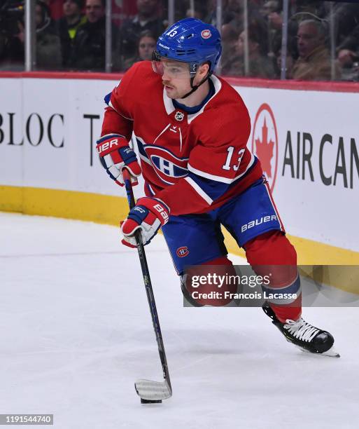 Max Domi of the Montreal Canadiens looks to pass the puck against the Boston Bruins in the NHL game at the Bell Centre on November 26, 2019 in...