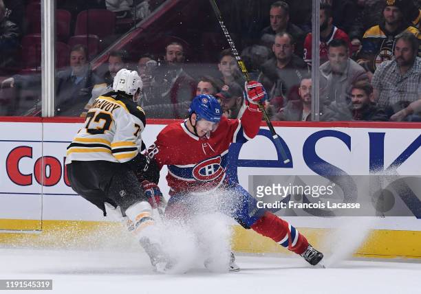 Mike Reilly of the Montreal Canadiens tries to slow down Charlie McAvoy of the Boston Bruins in the NHL game at the Bell Centre on November 26, 2019...