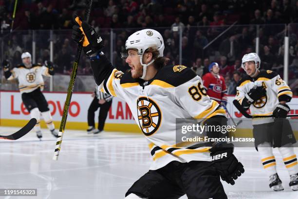 David Pastrnak of the Boston Bruins celebrates with teammates after scoring his second goal of the night against the Montreal Canadiens in the NHL...