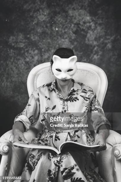 a woman with a cat mask - cat face mask stock pictures, royalty-free photos & images