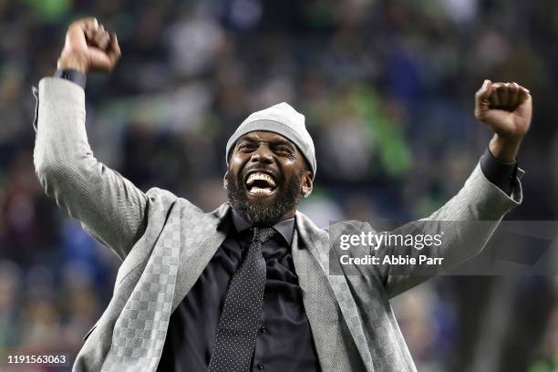 Former NFL player and current ESPN personality Randy Moss reacts during pregame before the game between the Minnesota Vikings and the Seattle...