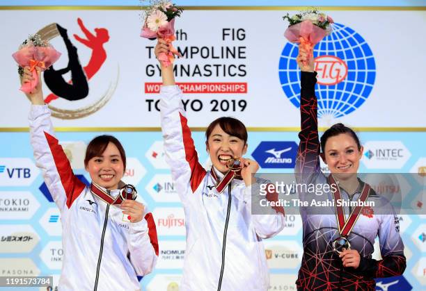 Silver medalist Chisato Doihata of Japan, gold medalist Hikaru Mori of Japan and bronze medalist Rosie MacLennan of Canada celebrate on the podium at...