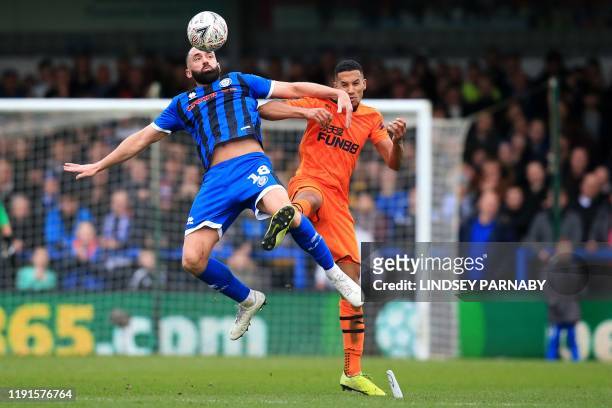 Rochdale's English striker Aaron Wilbraham vies with Newcastle United's English midfielder Isaac Hayden during the English FA Cup third round...