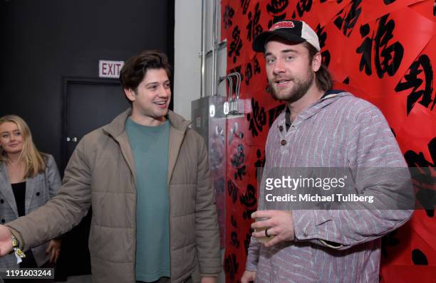Chris Galya and Luke Benward attend the VIP opening night for the Dumpling & Associates pop-up art exhibition at ROW DTLA on December 02, 2019 in Los...