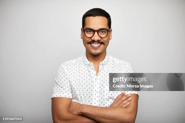 confident businessman with arms crossed - mustache isolated stock-fotos und bilder