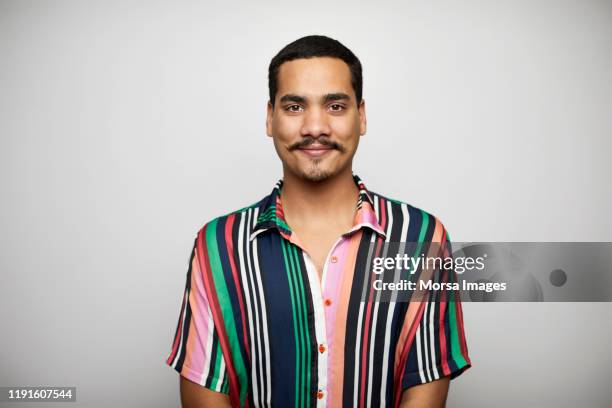 confident male against white background - schnurrbart stock-fotos und bilder