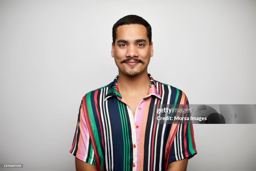 Confident male against white background