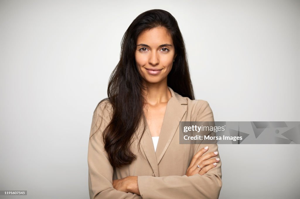 Confident businesswoman over white background