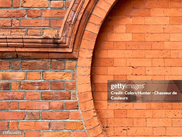 weathered brick wall with rounded shapes from london - decoration stock pictures, royalty-free photos & images