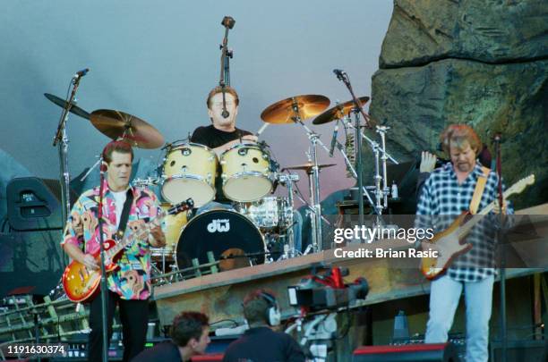 From left, Glenn Frey , Don Henley and Don Felder of American rock group The Eagles perform live on stage at Wembley Stadium in London during the...