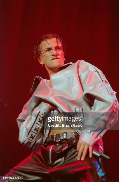 English born singer Peter Andre performs live on stage at the Top of the Pops Weekend Festival at Wembley Arena in London on 14th September 1996.