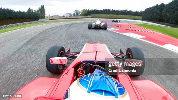 racing cars driving on track - motorsport event stock pictures, royalty-free photos & images