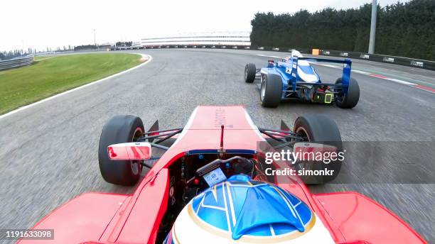 racing cars driving on track - will power race car driver stock pictures, royalty-free photos & images