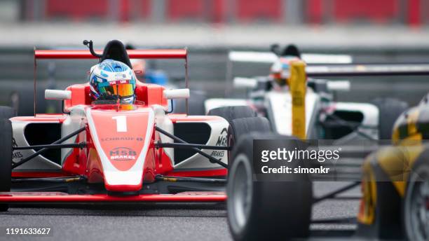 man driving racing car - grand prix motor racing stock pictures, royalty-free photos & images