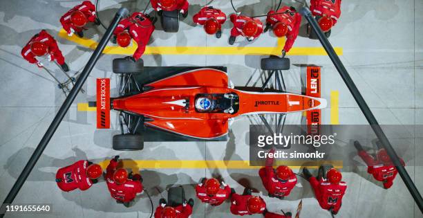 pit crew working at pit stop - motorsport stock pictures, royalty-free photos & images