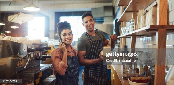 managing their daily duties like pros - restaurant manager phone stock pictures, royalty-free photos & images