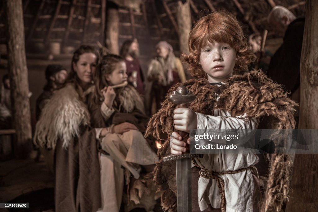 An individual viking child in a viking settlement