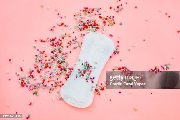 sanitary pad background in pink - sports period stockfoto's en -beelden