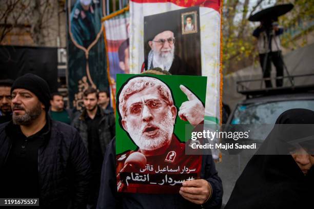 Iranians take part in an anti-US rally to protest the killings during a US air strike of Iranian military commander Qasem Soleimani and Iraqi...