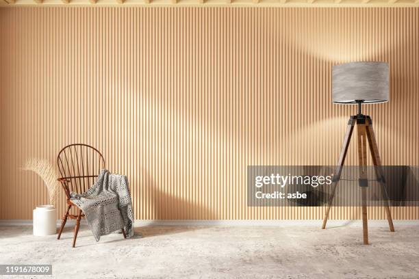 wooden interior with chair blanket and floor lamp - painel de madeira imagens e fotografias de stock