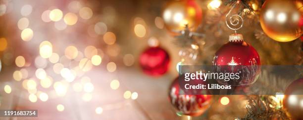 christmas tree and nativity ornaments with defocused lights background - religion stock pictures, royalty-free photos & images