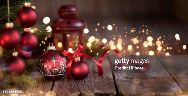 christmas tree and nativity ornaments on an old wood background - religion stock pictures, royalty-free photos & images