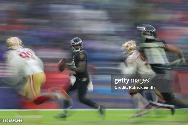 Quarterback Lamar Jackson of the Baltimore Ravens rushes against the San Francisco 49ers during the second half at M&T Bank Stadium on December 01,...