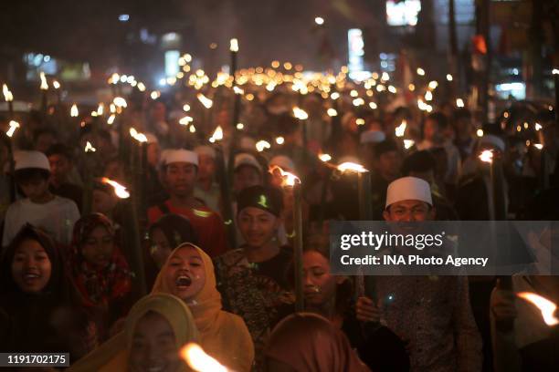 Thousands children Indonesian muslims in Bogor participate in a torch-lit parade to celebrate the Islamic New Year of 1 Muharram 1441 Hijri in Bogor,...