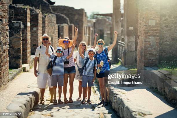 multi generation family sightseeing ancient ruins - pompeii stock pictures, royalty-free photos & images