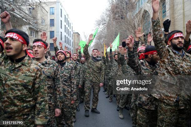 Iranian members of the Basij militia take part in an anti-US rally to protest the killing of Iranian Revolutionary Guards' Quds Force commander Qasem...