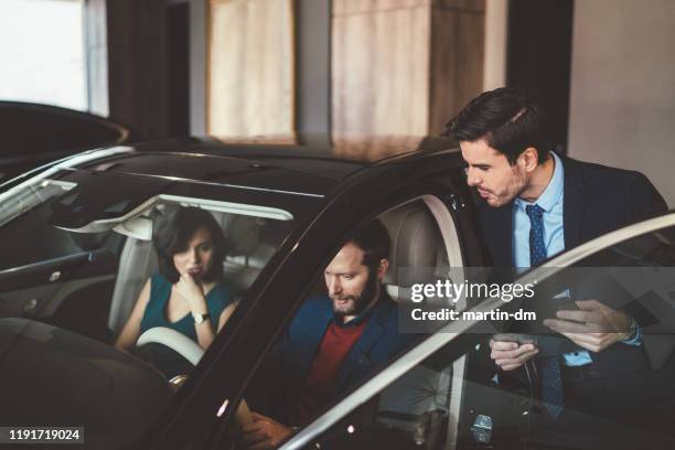 couple choosing new car - new husband stock pictures, royalty-free photos & images