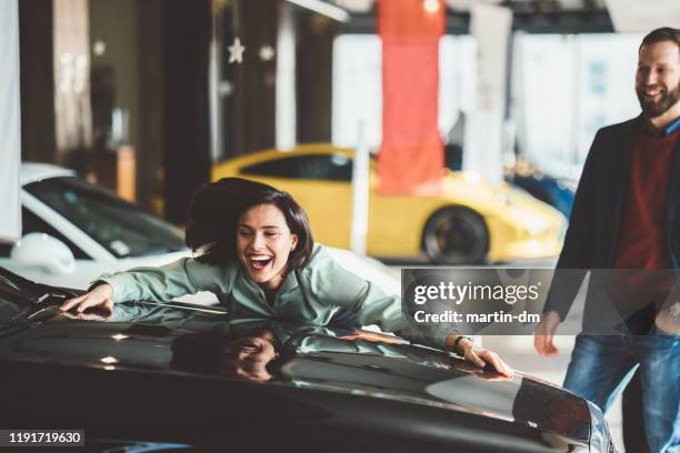 husband buying new car for his wife - loving your car stock pictures, royalty-free photos & images