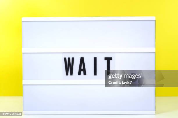 wait sign - wait sign sign stock pictures, royalty-free photos & images