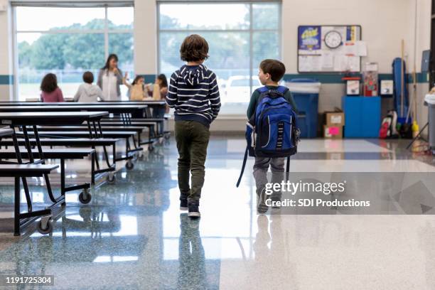 rear view of schoolboys in cafeteria - cafeteria stock pictures, royalty-free photos & images