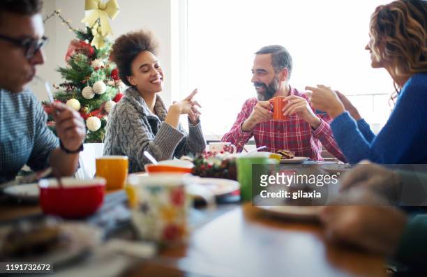 family having breakfast on christmas morning. - christmas breakfast stock pictures, royalty-free photos & images