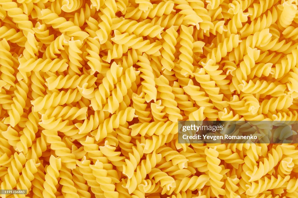 Uncooked fusilli pasta background