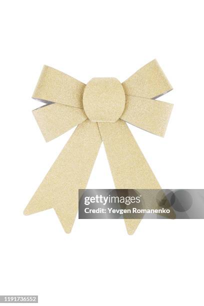 decorative glittering gold bow isolated on white background - goud beschrijvende kleur stockfoto's en -beelden