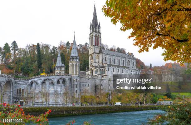 he basilica of our lady of the immaculate conception is a roman catholic church and minor basilica in lourdes france - our lady of lourdes stock pictures, royalty-free photos & images