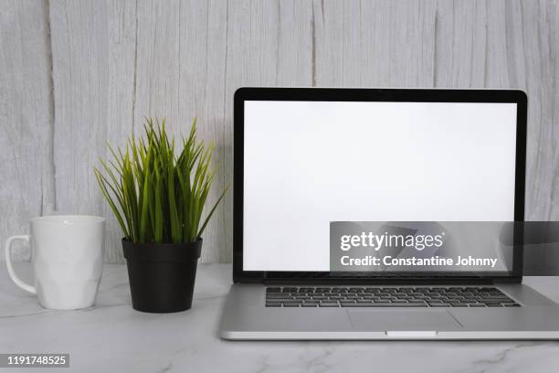 laptop with blank white screen and coffee mug on work desk - mug mockup stock pictures, royalty-free photos & images