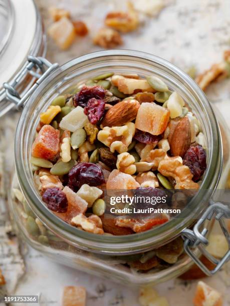 jar of trail mix - dry fruits stock pictures, royalty-free photos & images