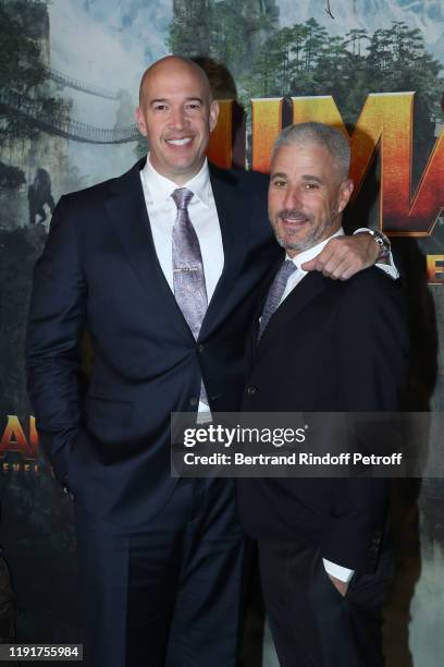 Producers of the movie Matt Tolmach and Hiram Garcia attend the photocall of the "Jumanji : Next Level" film at le Grand Rex on December 03, 2019 in...