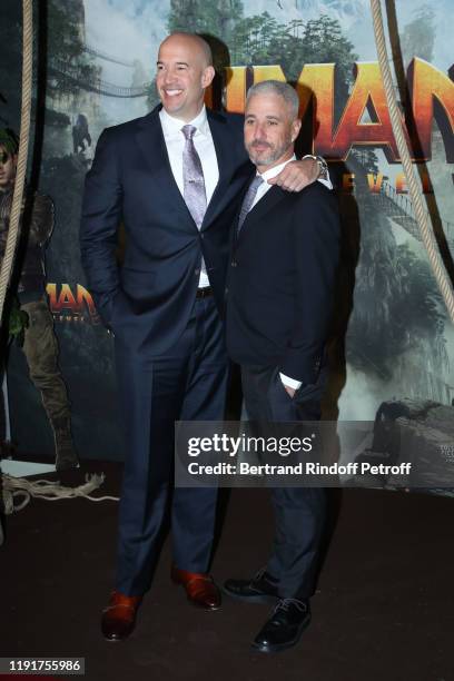 Producers of the movie Matt Tolmach and Hiram Garcia attend the photocall of the "Jumanji : Next Level" film at le Grand Rex on December 03, 2019 in...