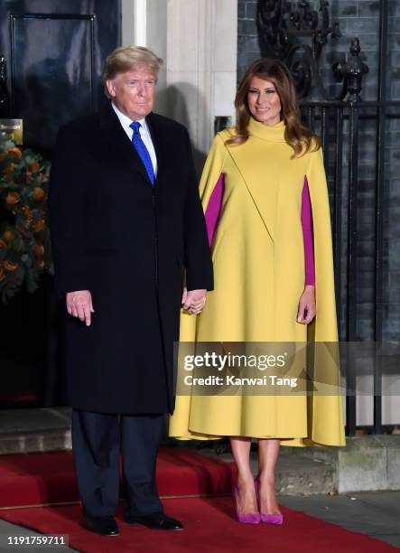 nato summit lady in yellow dress Melania Trump wears striking yellow cape to meet with Prince Charles and Camilla