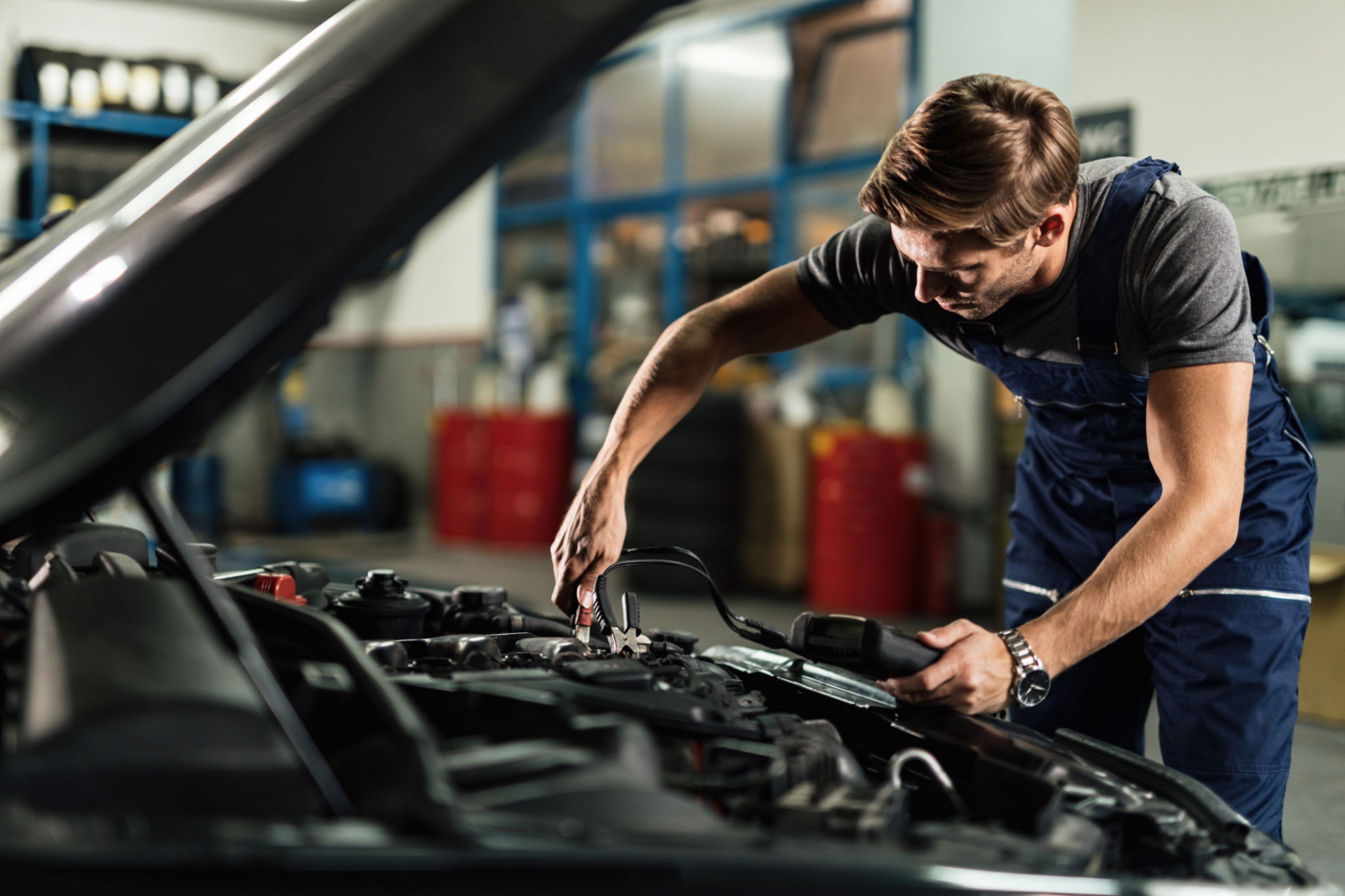 mechanic checking wires