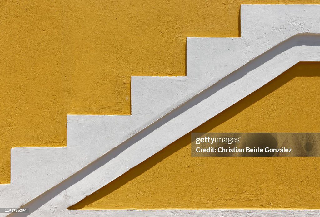 Vibrant yellow wall of Bo-Kaap, Cape Town - South Africa