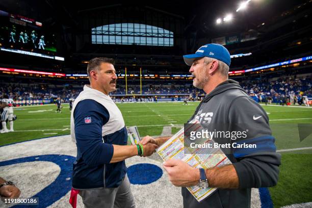 Head coach Mike Vrabel of the Tennessee Titans shakes hands with head coach Frank Reich of the Indianapolis Colts after the game at Lucas Oil Stadium...