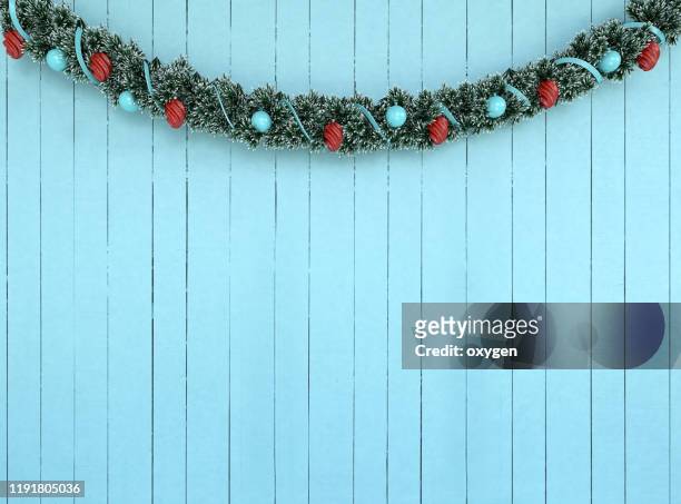 christmas garland decorationon on aqua wooden wall background, 3d rendering - garland stock-fotos und bilder