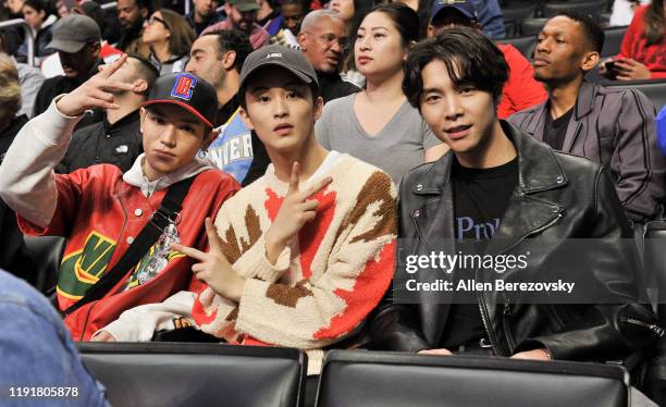Taeyong, Mark Lee, and Johnny Seo of NCT 127 attend a basketball game between the Los Angeles Clippers and Portland Trail Blazers at Staples Center...