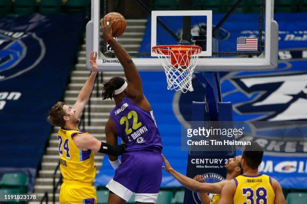 Chad Brown of the Texas Legends dunks over Travis Wear of the South Bay Lakers in the first quarter on January 04, 2020 at Comerica Center in Frisco,...