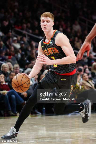 Kevin Huerter of the Atlanta Hawks controls the ball during the second quarter of a game against the Indiana Pacers at State Farm Arena on January 4,...